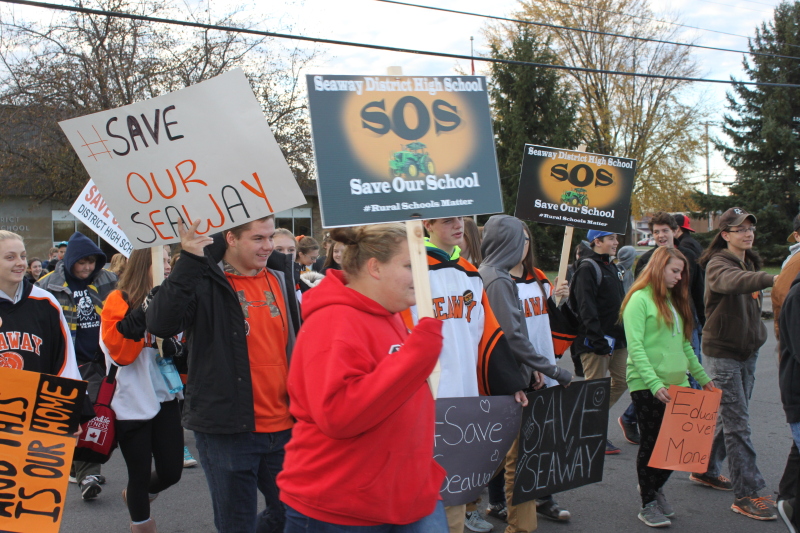 High school students rally against school closures